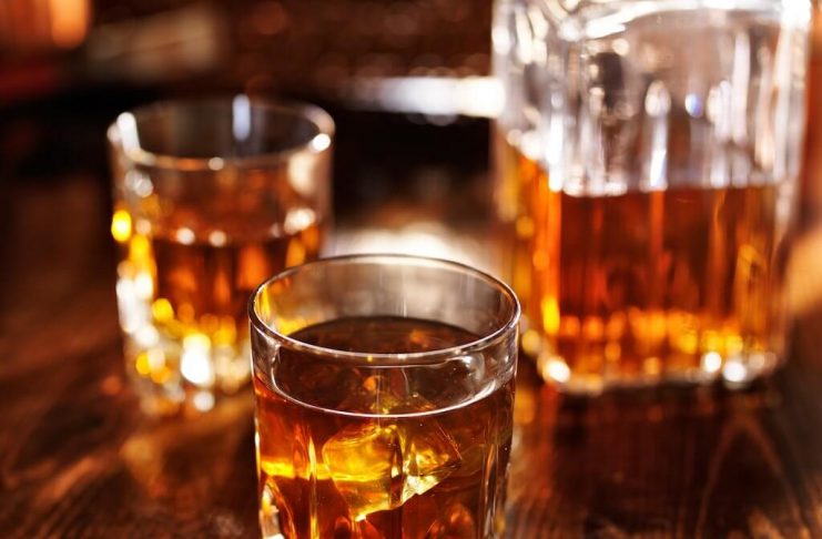 Social Media Brainstorming Sessions Made Simple glass of whiskey on a table